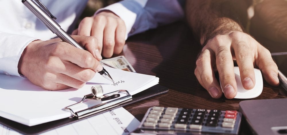 Office, business tools with dollars and calculator on table